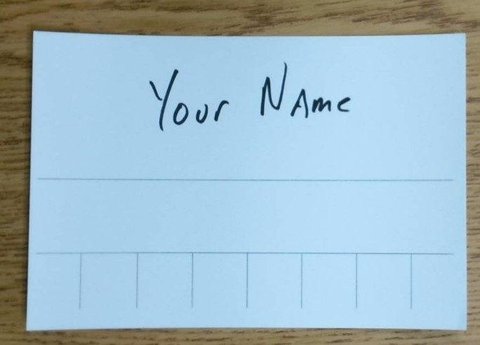 Index card with name written in the top section